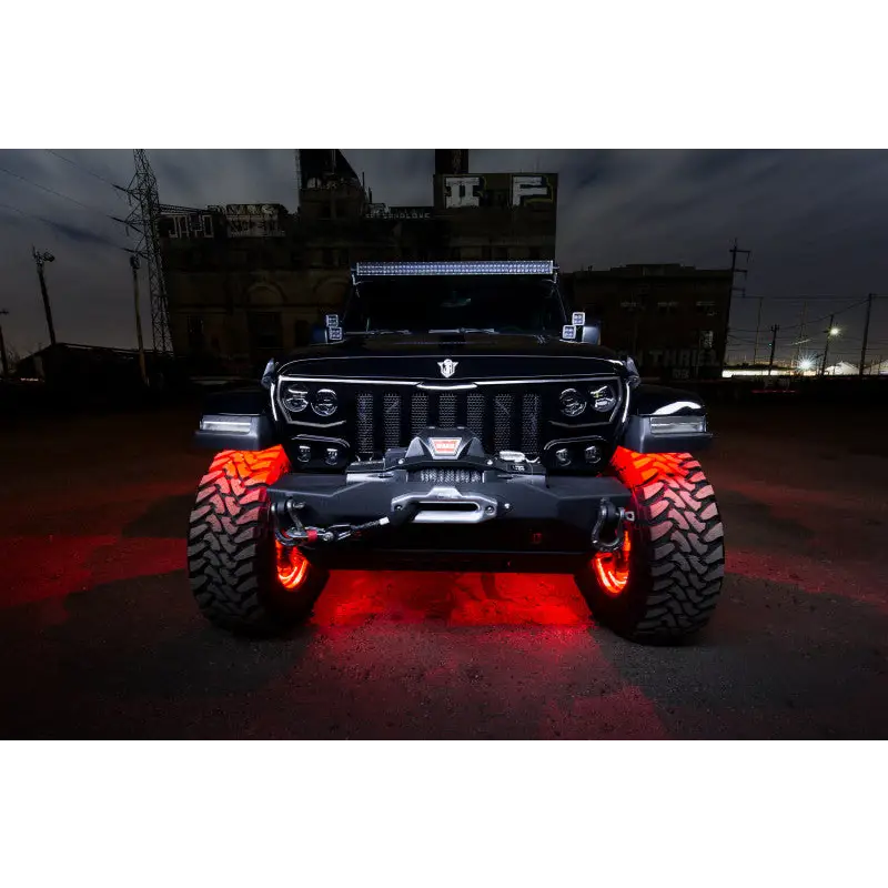 Jeep with red LED rock lights from Oracle Bluetooth + RF Underbody Rock Light Kit.
