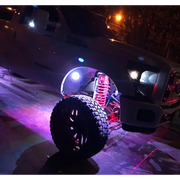 Truck with large tire parked on street - Oracle Bluetooth + RF Underbody Rock Light Kit - 8 PCS - ColorSHIFT