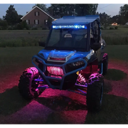 Blue and pink rock light kit with lights on for Oracle Bluetooth + RF Underbody Rock Light Kit.