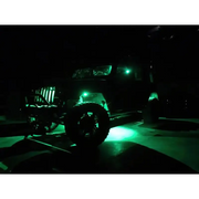 Green LED rock light kit on jeep in dark with ColorSHIFT feature