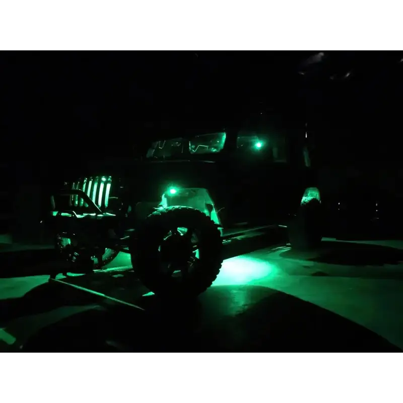 Green LED rock light kit on jeep in dark with ColorSHIFT feature