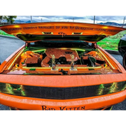Close up of car with trunk full of Halloween decorations, featuring Oracle Engine Bay 5050 SMD Kit - RGB ColorSHIFT.