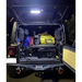 Truck with luggage in back showcasing Oracle Jeep Wrangler JL Cargo LED Light Module - Amber/White.