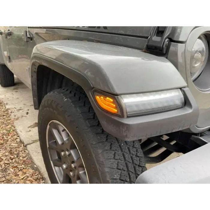 Close-up of Oracle Jeep Wrangler JL Smoked Lens LED Front Sidemarkers car tire and bumper