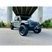 Smoked lens LED sidemarkers on Oracle Jeep Wrangler JL parked under bridge with dog in back seat