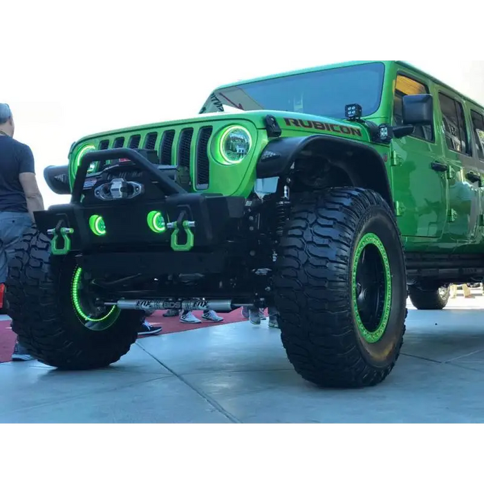 Green Jeep Wrangler JL halo fog light kit with big tire.