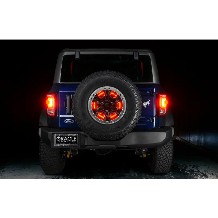 Jeep with illuminated wheel ring 3rd brake light and tire cap.