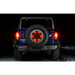 Jeep with illuminated wheel ring 3rd brake light and tire cap.