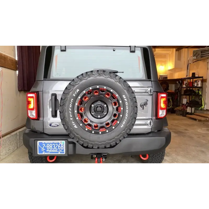 Jeep with tire cover featuring Oracle LED Illuminated 3rd Brake Light