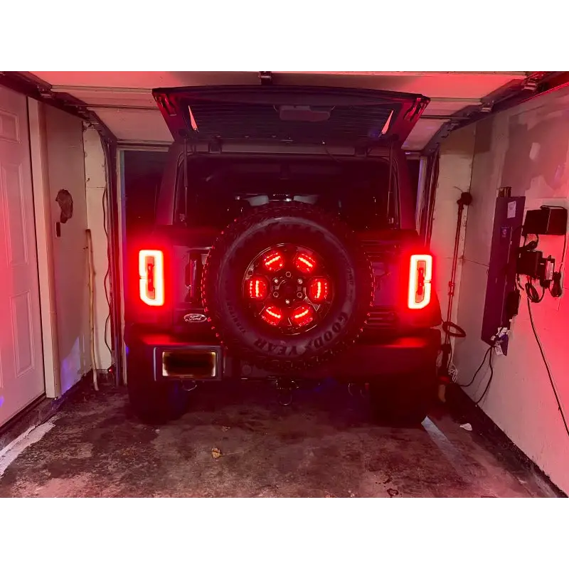 Rear view of vehicle with Oracle LED Illuminated Wheel Ring 3rd Brake Light - Red
