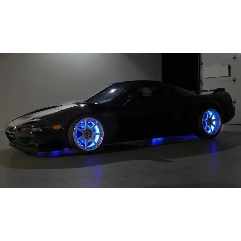 Wheel rings with blue lights on black car - Oracle LED Illuminated.