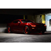 Red car in parking lot with Oracle LED Illuminated Wheel Rings - ColorSHIFT - 15in.