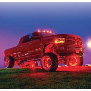 Red truck with illuminated wheel rings by Oracle LED.