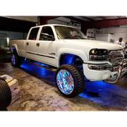 White truck with blue LED illuminated wheel rings by Oracle LED Illuminated - ColorSHIFT.