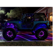 Oracle LED Illuminated Wheel Rings with purple lights on a jeep