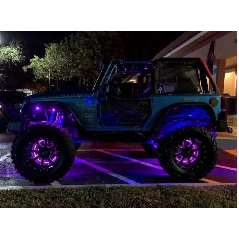 Oracle LED Illuminated Wheel Rings with purple lights on a jeep