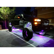 Purple LED illuminated wheel rings on a truck