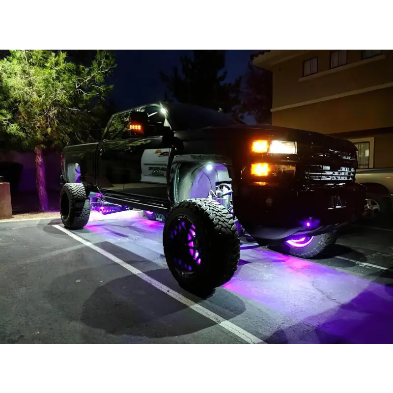 Purple LED illuminated wheel rings on a truck