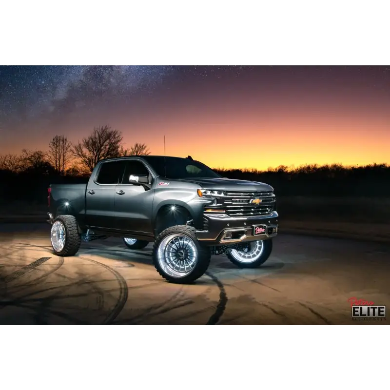 Oracle LED Illuminated Wheel Rings on Truck in Desert at Night