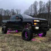 Black truck with purple wheels displaying Oracle LED Illuminated Wheel Rings - ColorSHIFT without Remote