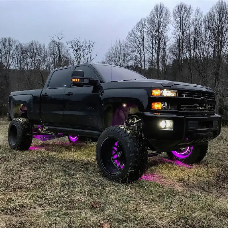 Black truck with purple wheels displaying Oracle LED Illuminated Wheel Rings - ColorSHIFT without Remote