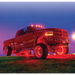 Red LED wheel ring kit on a truck with lights.