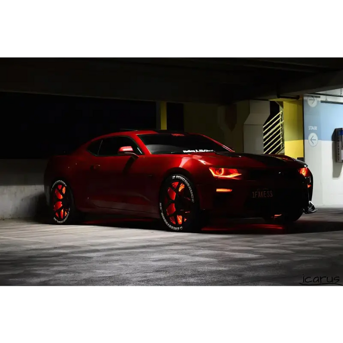 Red LED wheel ring kit with Oracle Illuminated Wheel Rings - Double LED parked in parking garage.