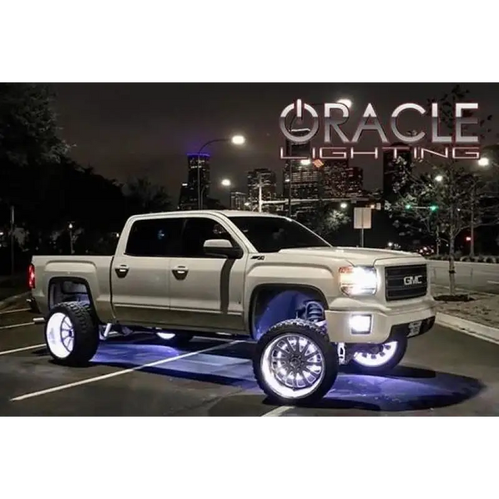 Oracle LED Illuminated Wheel Rings - Double LED - White truck with black rim and chrome wheels.