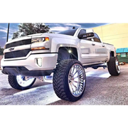 White truck with LED wheel ring kit installed.