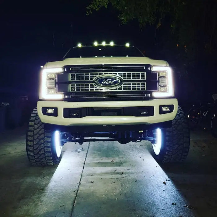 White LED wheel ring kit on truck bumper.