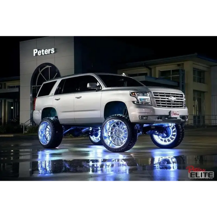 White SUV with black rim and chrome wheels showcasing Oracle LED Illuminated Wheel Rings - Double LED - White.