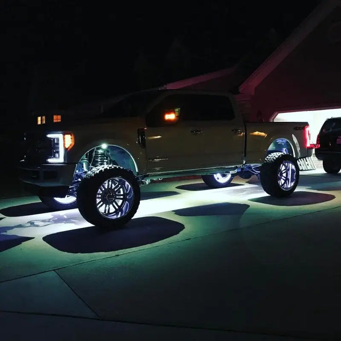 Oracle LED Wheel Ring Kit with Double LED Lights on Truck Parked in Driveway