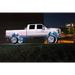 White Oracle LED illuminated wheel rings on truck with blue light.