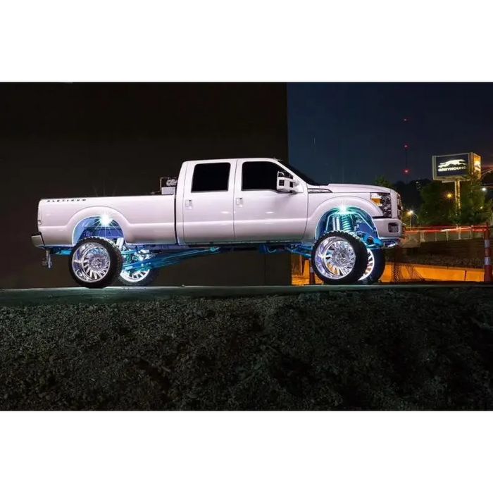 LED illuminated white wheel rings on a truck with blue light