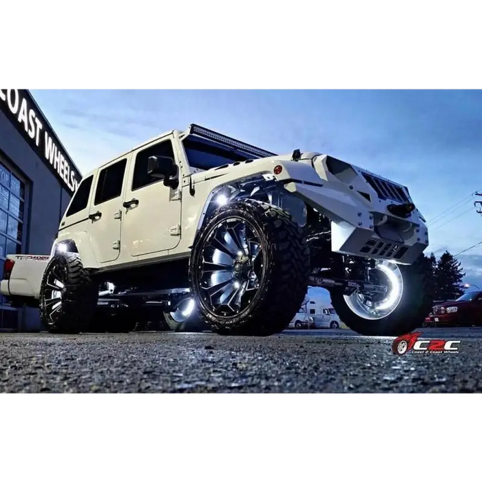 White Jeep with Big Tire and Rim featuring Oracle LED Illuminated Wheel Rings