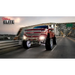 Red truck with LED illuminated wheel rings driving down highway - Oracle LED Illuminated Wheel Rings - White.