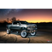 Truck parked in desert at night with LED illuminated wheel rings