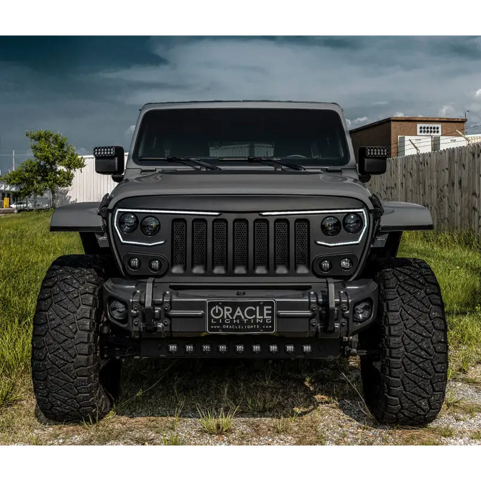 Front end view of black Jeep with skid plate and integrated LED emitters by ORACLE Lighting.