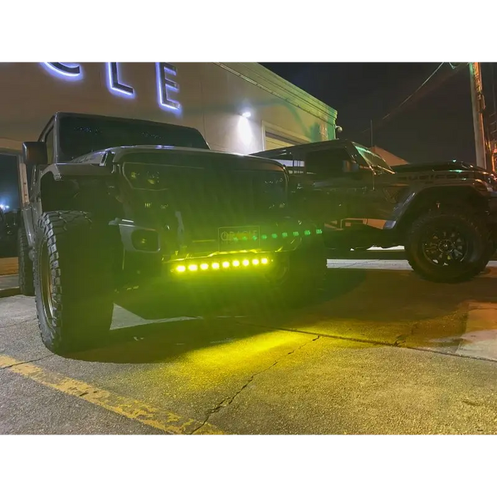 Black truck with integrated LED emitters on ORACLE Lighting skid plate.