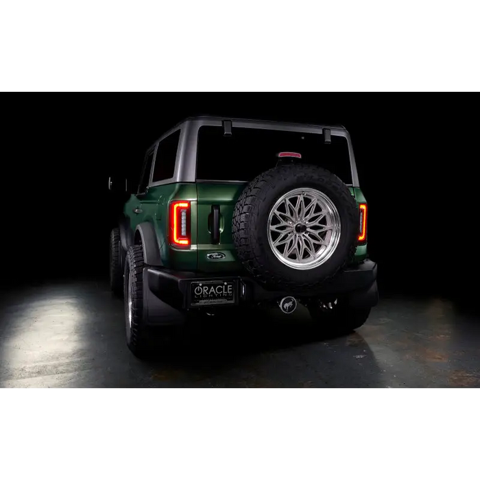 Oracle Lighting LED Tail Lights for Ford Bronco - Rear end of green jeep, black background