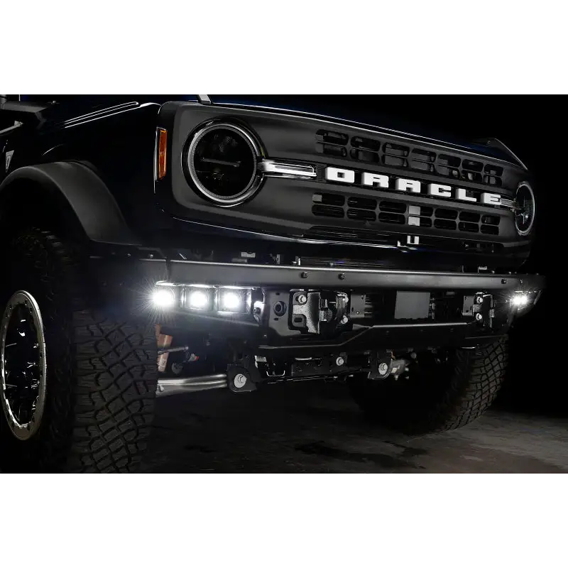Black Ford truck featuring ORACLE Lighting LED Fog Light Kit for Steel Bumper - White