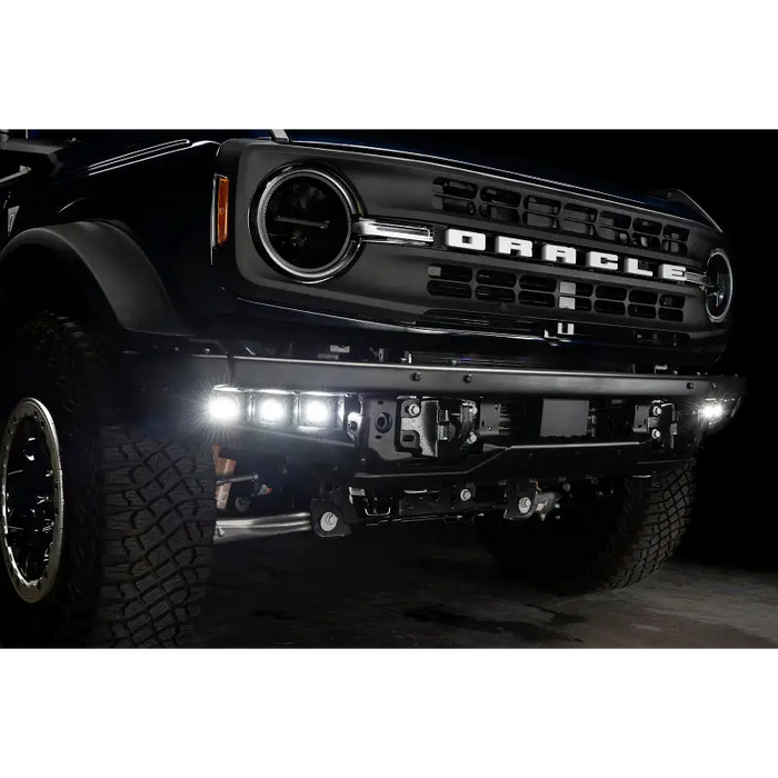 Black Ford truck featuring ORACLE Lighting LED Fog Light Kit for Steel Bumper - White