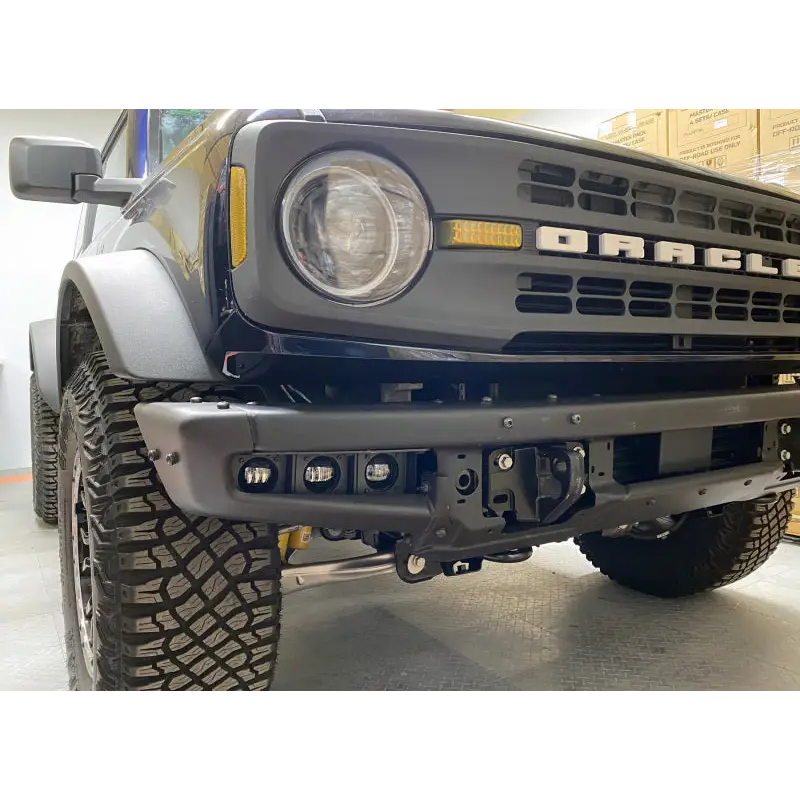 Black truck with big bumper ORACLE Lighting Triple LED Fog Light Kit - White.
