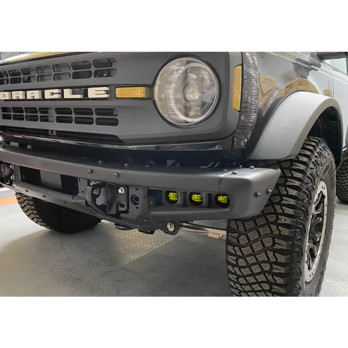 Yellow fog light kit truck parked in a garage.