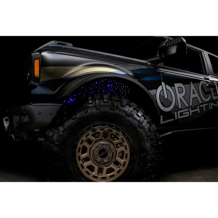 Black truck with light on Oracle Lighting Fiber Optic Wheel Liner ColorSHIFT RGBW Kit - SEO: wheel liners, oracle lighting, fiber optic.