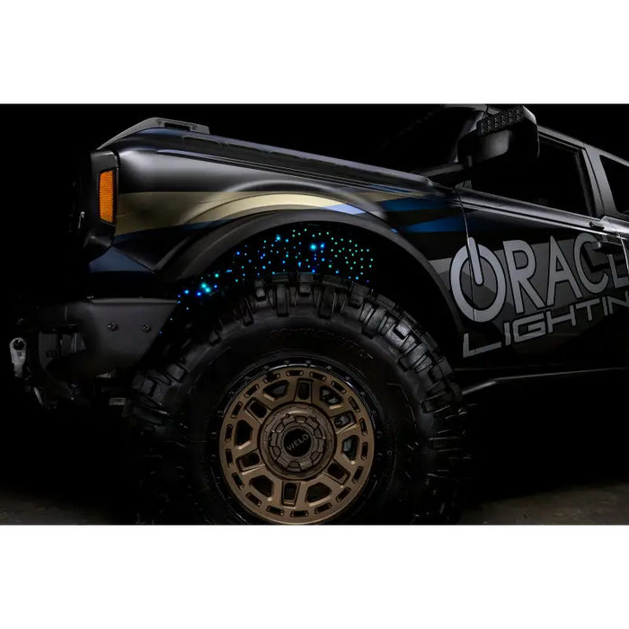 Black truck with light featuring Oracle Lighting Fiber Optic Wheel Liner ColorSHIFT RGBW Kit.