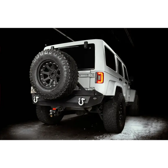 White Jeep parked in garage with Oracle Lighting Jeep Wrangler JK Flush Mount LED Tail Lights.