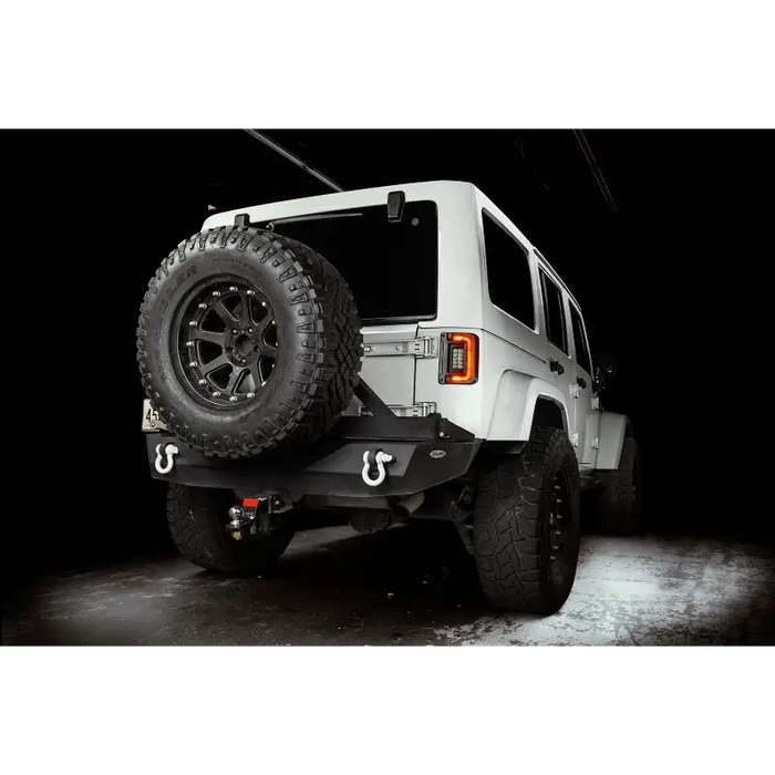 White Jeep Wrangler JK with flush mount LED tail lights in garage