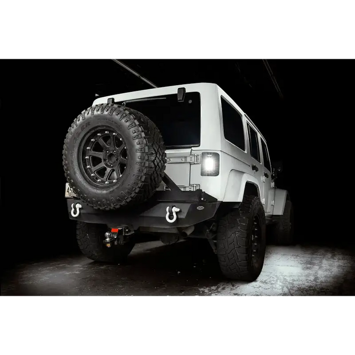 Oracle Lighting Jeep Wrangler JK Flush Mount LED Tail Lights with customized jeep parked in dark room