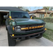 Green truck parked in front of house next to ORACLE Lighting Universal Illuminated LED Letter Badges - Matte Black Surface Finish - B